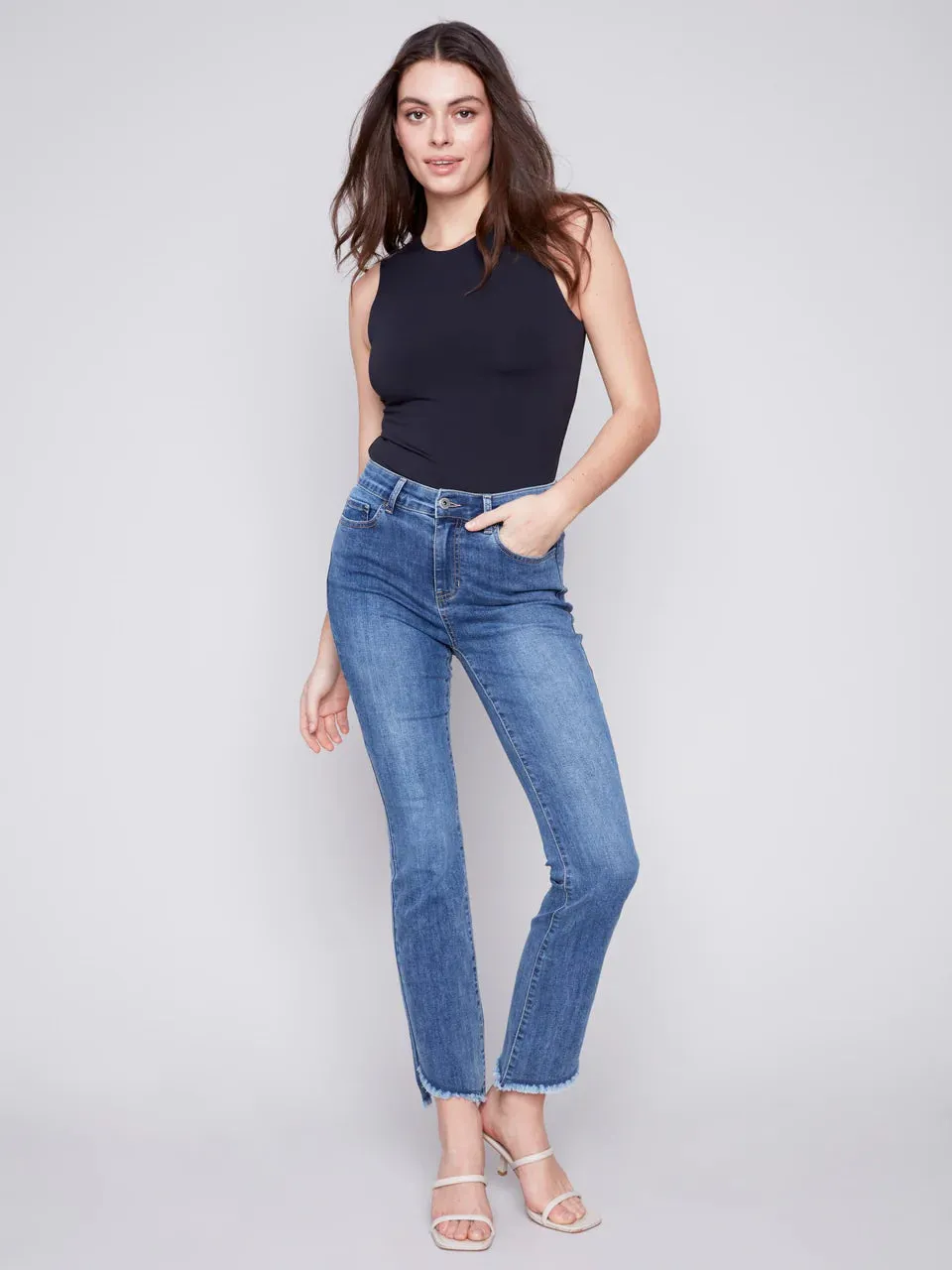 BOOTCUT JEANS WITH ASYMMETRICAL HEM